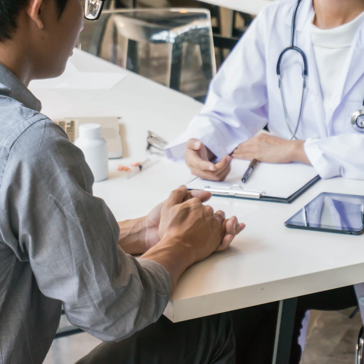 An adult child connecting with an elderly parent about their health